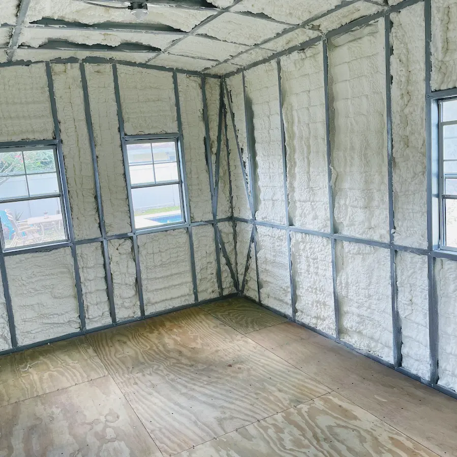 Closed-cell spray foam insulation applied to wall cavities in a residential project in Hales Corners